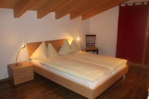 Postel nebo postele na pokoji v ubytování Wakatipu-Lodge