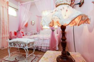 Postel nebo postele na pokoji v ubytování Love in Pearl B&B