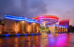 a large building with blue and red and blue lights at Le chateau Motel in Zhushan