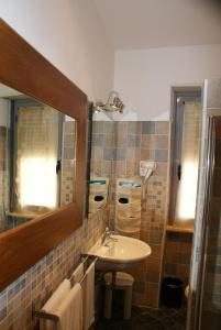 Ett badrum på Hotel Accursio