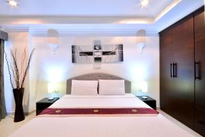 Ένα ή περισσότερα κρεβάτια σε δωμάτιο στο View Talay Residence 6 Wongamat Beach +133 φωτογραφίες