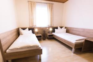 Postel nebo postele na pokoji v ubytování Hotel Palko