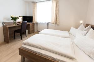 Postel nebo postele na pokoji v ubytování Hotel Palko
