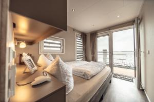 Postel nebo postele na pokoji v ubytování Goitzsche Resort + 37 fotografií