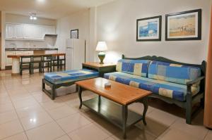 a living room with a couch and a table at Apartamentos Baja Del Secreto in Valle Gran Rey +17 photos