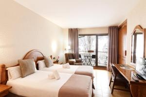 Hotel Sant Gothard客房内的一张或多张床位