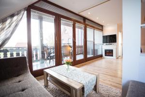 a living room with a couch and a table at Ferienwohnungen in Wremen in Wremen