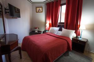 Postel nebo postele na pokoji v ubytování Residence Hotel Assounfou
