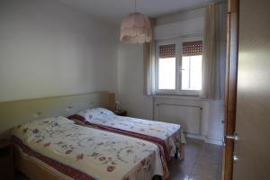 En eller flere senge i et værelse på Residence Cascata Varone