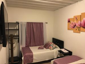 Katil atau katil-katil dalam bilik di Hotel El Coliseo