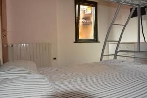 A bed or beds in a room at PudApartment Holiday Home