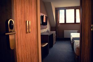 Postel nebo postele na pokoji v ubytování Hotel Opara