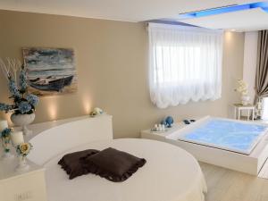Cama ou camas em um quarto em Bellariva Monopoli B&B e Relax