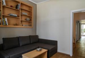 a living room with a couch and a table at Miranda's Apartment in Thissio in Athens