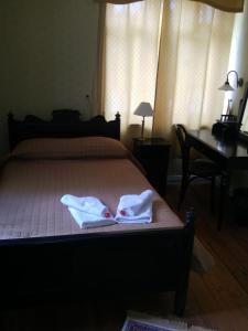 Postel nebo postele na pokoji v ubytování Mamma Mia Guest House