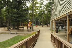 a park with a playground next to a building at Gateway to Cape Cod ADA Accessible Cottage 6 in Rochester