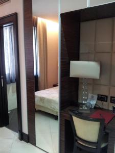 Postel nebo postele na pokoji v ubytování Hotel Excelsior