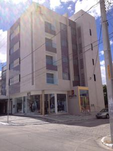 a building on the corner of a street at Etiqueta Hotel in Santa Cruz do Capibaribe