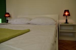 Postel nebo postele na pokoji v ubytování Aurelia Apartment