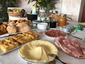 a table topped with lots of different types of food at Porto Monte in Maceira
