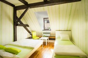 Postel nebo postele na pokoji v ubytování Hostel Centar