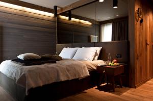 Postel nebo postele na pokoji v ubytování Alexander Charme Hotel