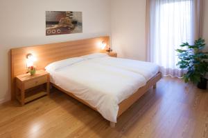 Postel nebo postele na pokoji v ubytování Appartamenti Regina