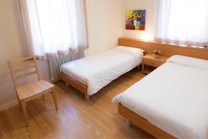 Postel nebo postele na pokoji v ubytování Appartamenti Regina