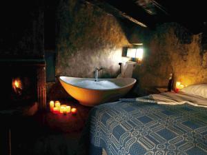 Katil atau katil-katil dalam bilik di Sextantio Albergo Diffuso