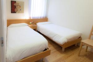 Postel nebo postele na pokoji v ubytování Appartamenti Regina