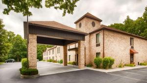 a large brick building with a tower on top at Best Western Plaza Hotel Saugatuck in Saugatuck