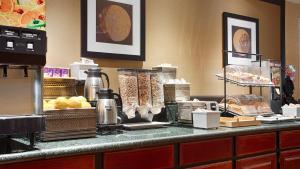 a kitchen counter filled with lots of food at Best Western Rockland in Rockland