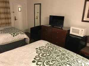 Letto o letti in una camera di Discovery Inn