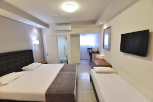 Postel nebo postele na pokoji v ubytování Hotel Maman