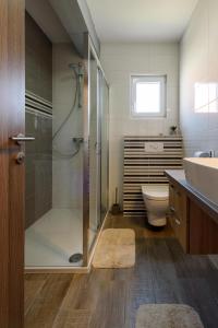 a bathroom with a shower and a toilet and a sink at Apartment Danijela in Trogir