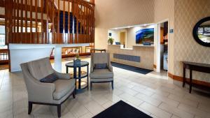 a lobby with two chairs and a table at Best Western Benton Harbor – St. Joseph in Benton Harbor