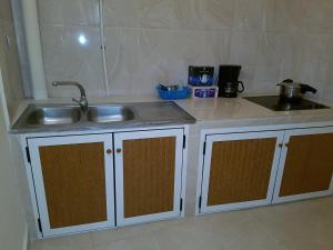 Kuchyň nebo kuchyňský kout v ubytování Appartement alhoceima