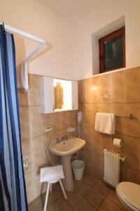 a bathroom with a sink and a toilet at Hotel La Marinella in Castiglioncello +53 photos