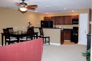 a kitchen and living room with a table and chairs at Lafayette Grand Manor in Waynesville