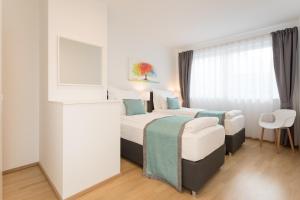 Łóżko lub łóżka w pokoju w obiekcie Mar Suite Apartments - Center
