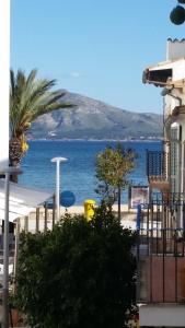 a view of the ocean from a building at La Gola apartaments in Port de Pollensa