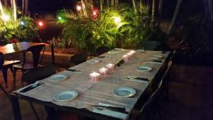 a long table with plates and napkins on it at Cattleman's Rest Motor Inn in Charters Towers