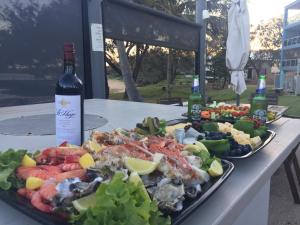 
a plate of food on a table at Bargara Shoreline Apartments in Bargara
