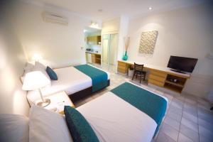 Letto o letti in una camera di Lazy Lizard Motor Inn