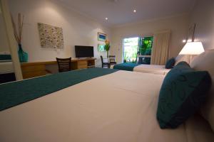 Letto o letti in una camera di Lazy Lizard Motor Inn