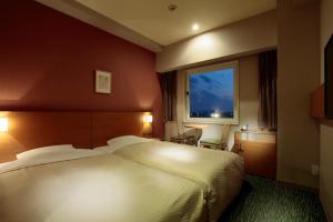 Postel nebo postele na pokoji v ubytování Candeo Hotels Sano + 37 fotografií