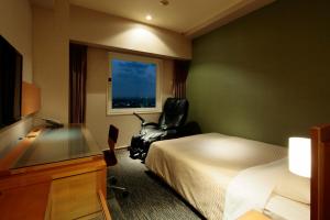 Postel nebo postele na pokoji v ubytování Candeo Hotels Sano