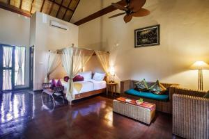 Voodi või voodid majutusasutuse Junjungan Ubud Hotel and Spa toas