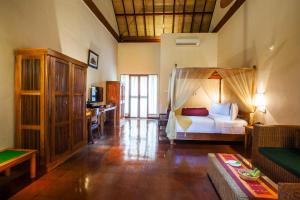 Voodi või voodid majutusasutuse Junjungan Ubud Hotel and Spa toas