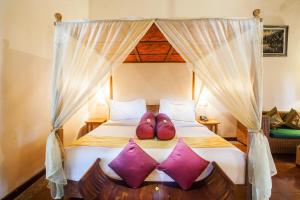 Voodi või voodid majutusasutuse Junjungan Ubud Hotel and Spa toas